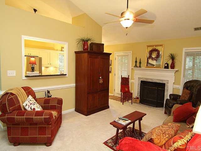 8705 Walkelin Court Raleigh, NC 27615 - Photo 3 of 12 Another view of the family room shows the pass through to the kitchen and the exit to the screened porch.