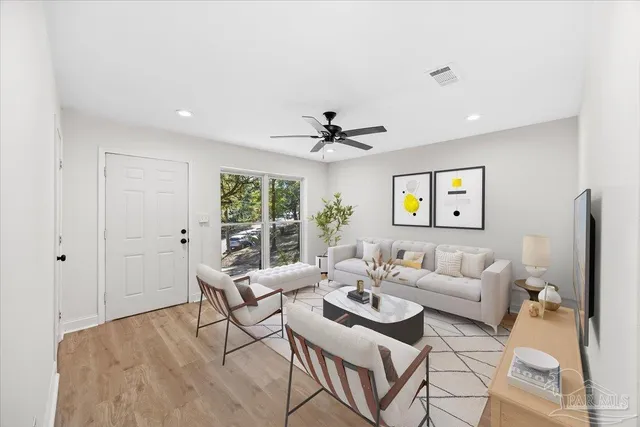 a living room with furniture and a window