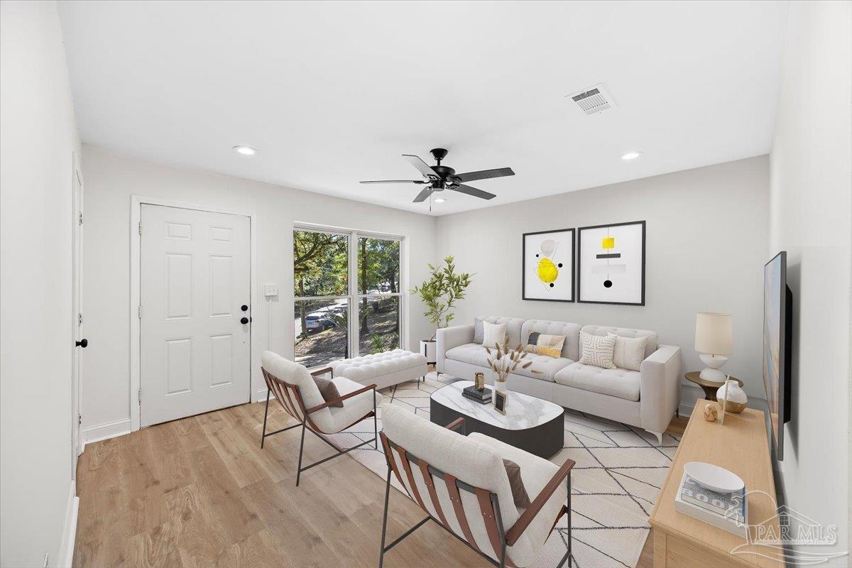 5149 Crestwood Road Pensacola, FL 32503 - Photo 16 of 53 a living room with furniture and a window