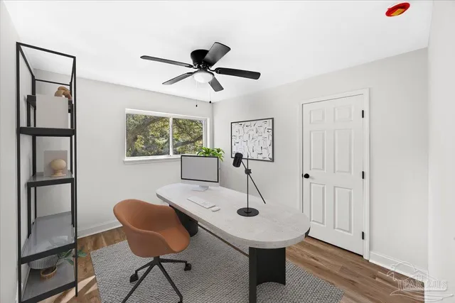 a view of a room with furniture and a window