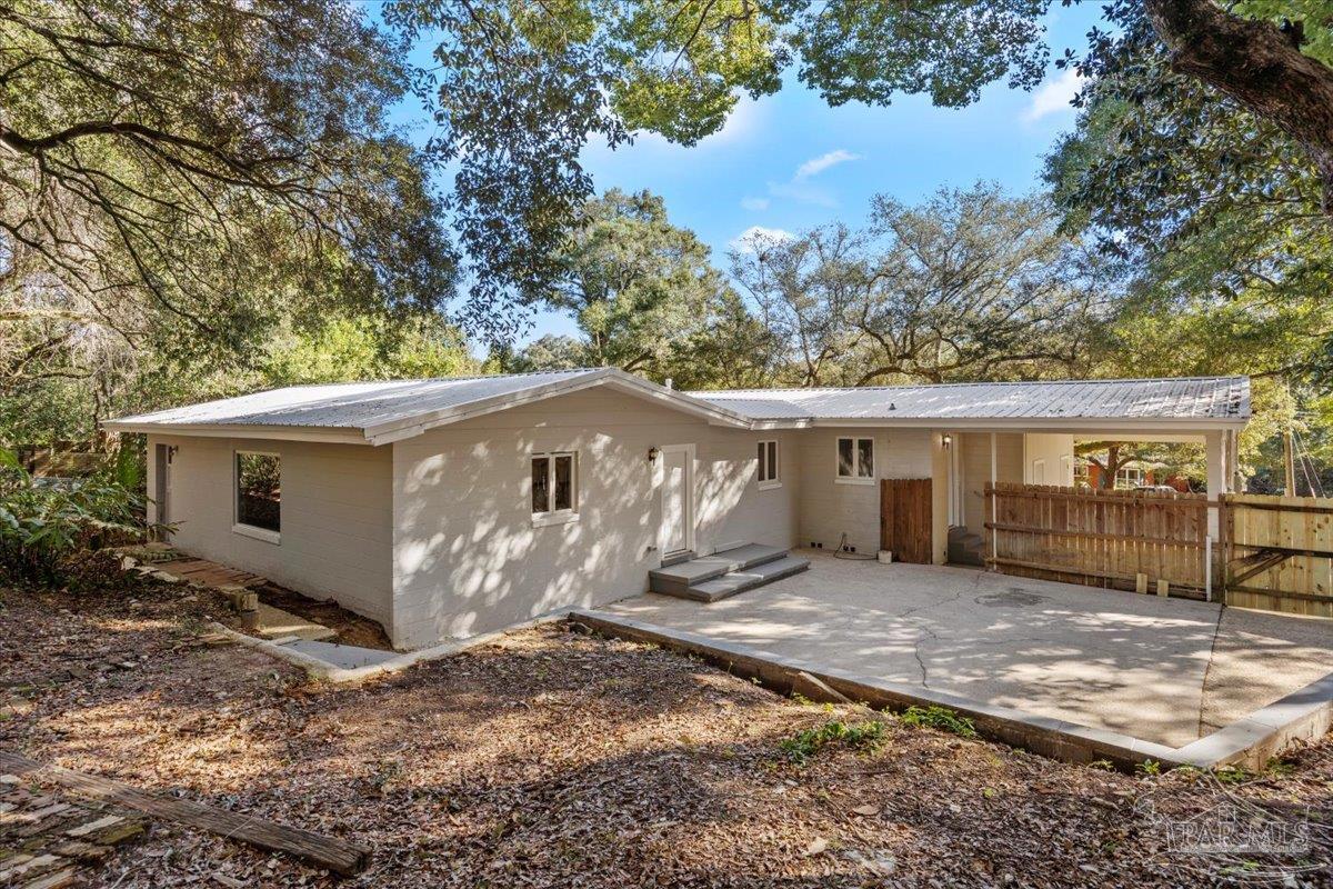 5149 Crestwood Road Pensacola, FL 32503 - Photo 28 of 53 a view of a house with a yard