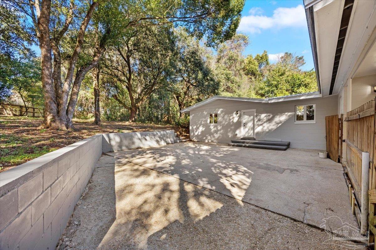 5149 Crestwood Road Pensacola, FL 32503 - Photo 29 of 53 a street view with large trees