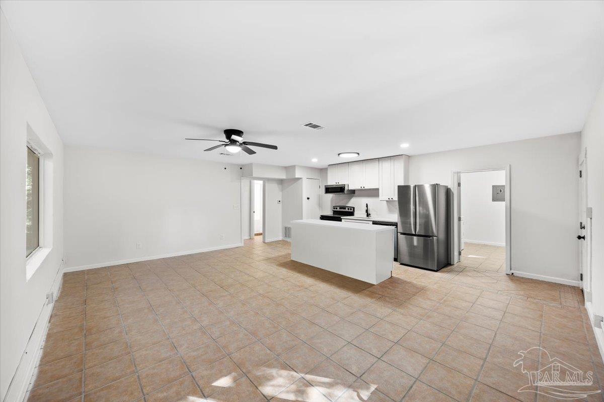 5149 Crestwood Road Pensacola, FL 32503 - Photo 30 of 53 a view of a kitchen with refrigerator and ceiling fan
