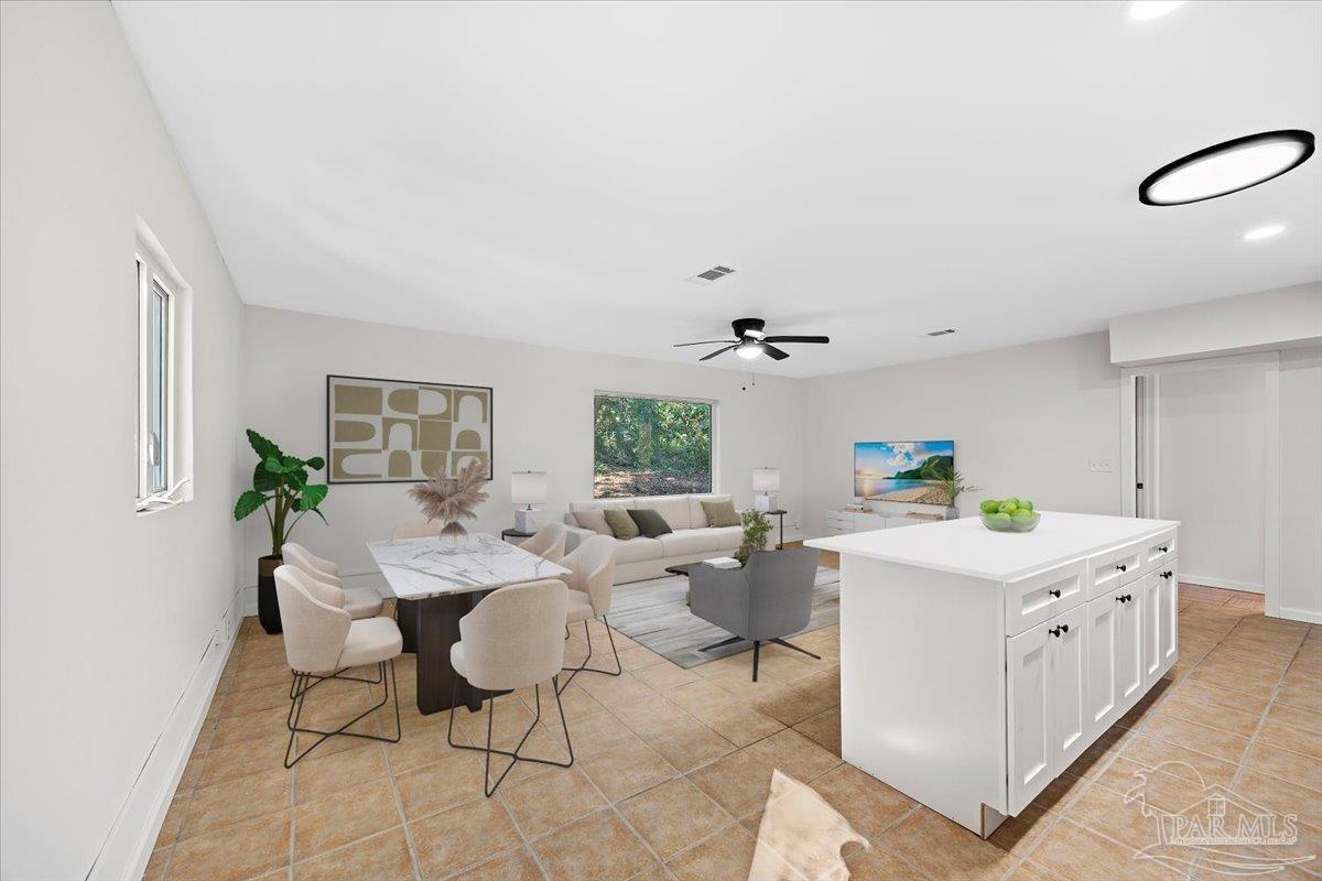 5149 Crestwood Road Pensacola, FL 32503 - Photo 33 of 53 a living room with kitchen island furniture and a window