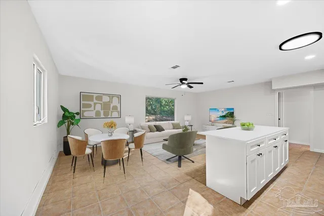 a living room with a couch and a window