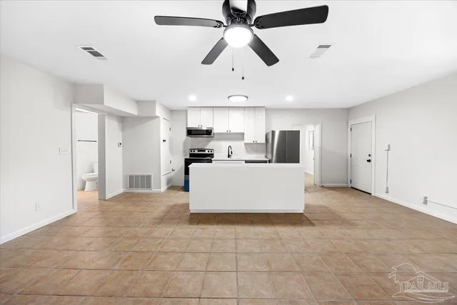 a view of a kitchen with an empty space