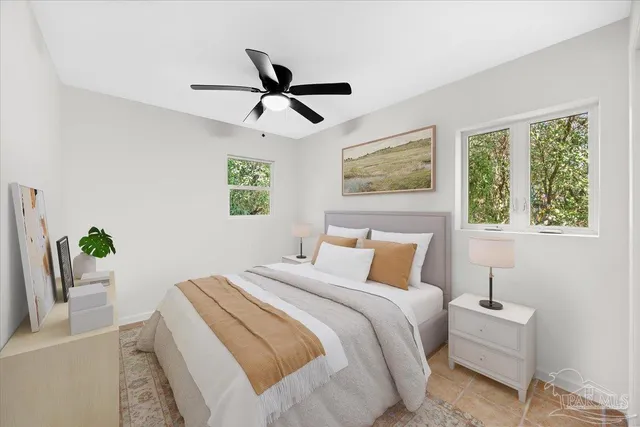 a bedroom with a bed and a window