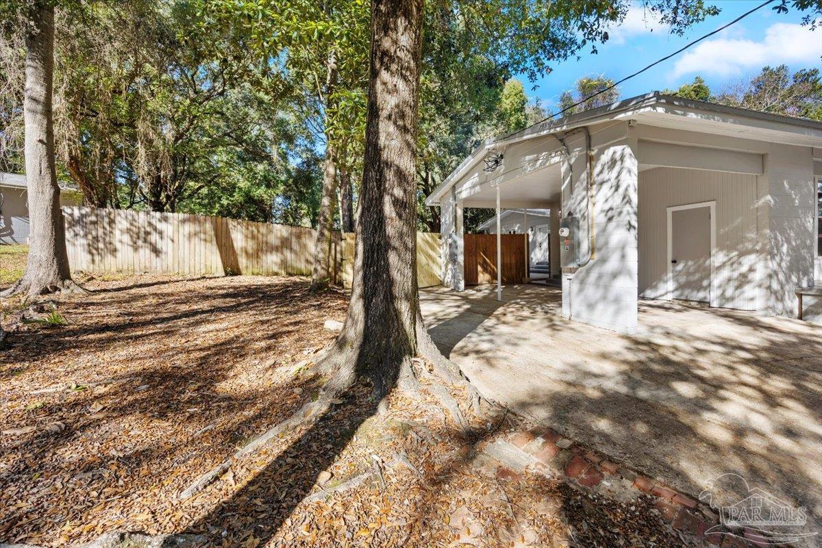 5149 Crestwood Road Pensacola, FL 32503 - Photo 42 of 53 a view of a house with a yard covered in snow