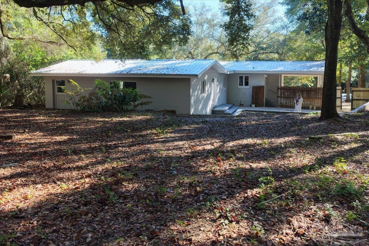 5149 Crestwood Road Pensacola, FL 32503 - Photo 45 of 53 a view of a house with a yard