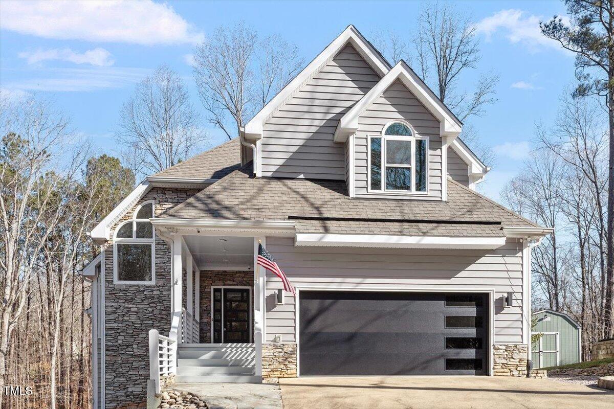 a front view of a house with a garage