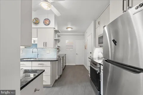 a view of utility room and hall