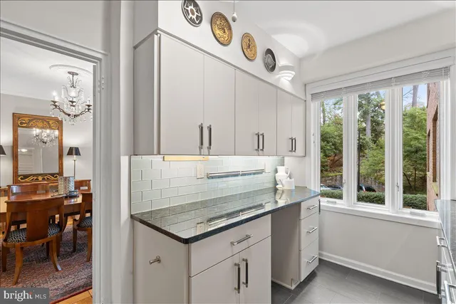 a kitchen with cabinets a sink and appliances