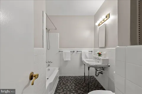 a bathroom with a bathtub and shower