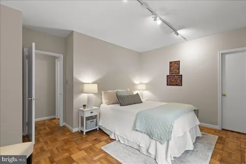 a view of swimming pool with lounge chair and sky view