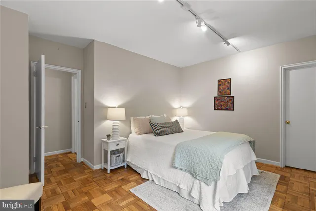a view of swimming pool with lounge chair and sky view