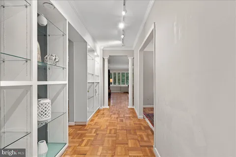 a view of living room and wooden floor