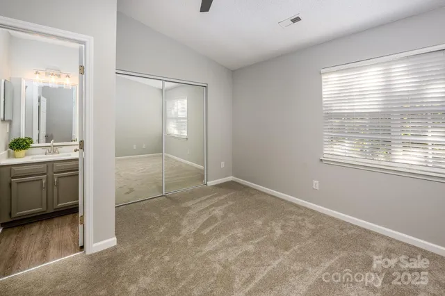 a view of a kitchen with a sink dishwasher and fireplace