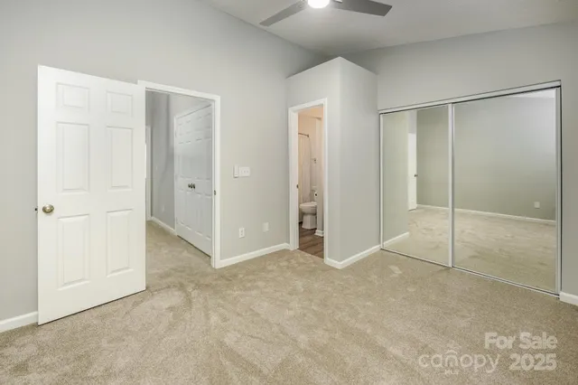 a bathroom with a sink a toilet and shower curtain