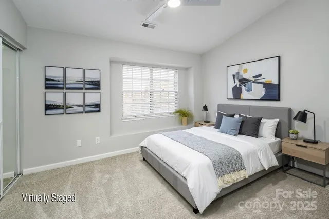 a bedroom with bed and window