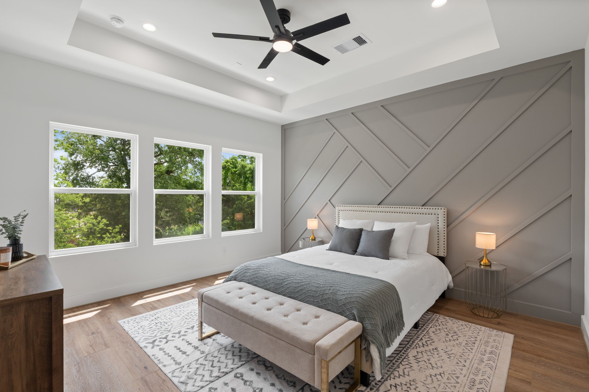 a bedroom with a large bed and a window