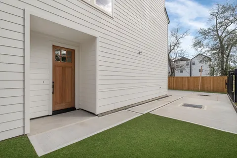 a view of backyard with garage