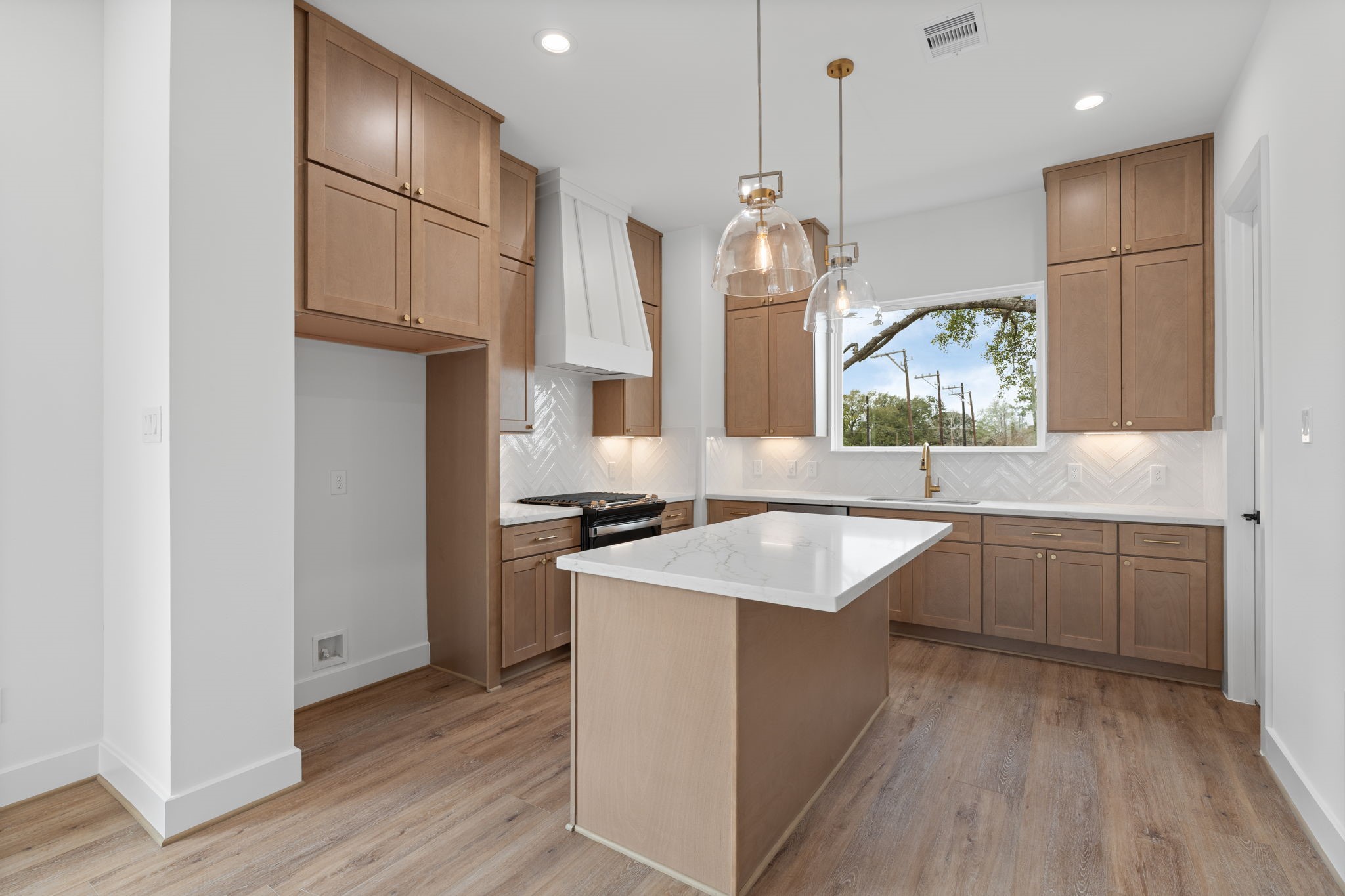 826 Curtin Street, Unit F Houston, TX 77018 - Photo 6 of 37 a kitchen with stainless steel appliances granite countertop a sink stove and refrigerator