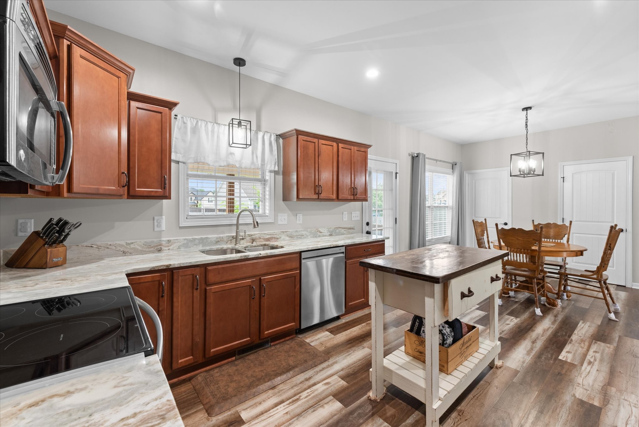 3758 Suiter Road Clarksville, TN 37040 - Photo 12 of 33 a kitchen with granite countertop a sink stove and cabinets