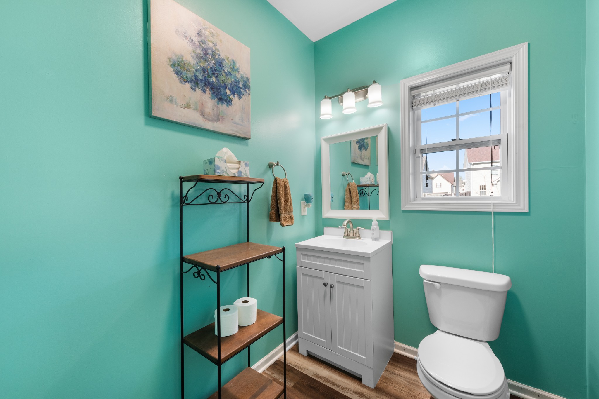 3758 Suiter Road Clarksville, TN 37040 - Photo 14 of 33 a bathroom with a toilet a sink and a window