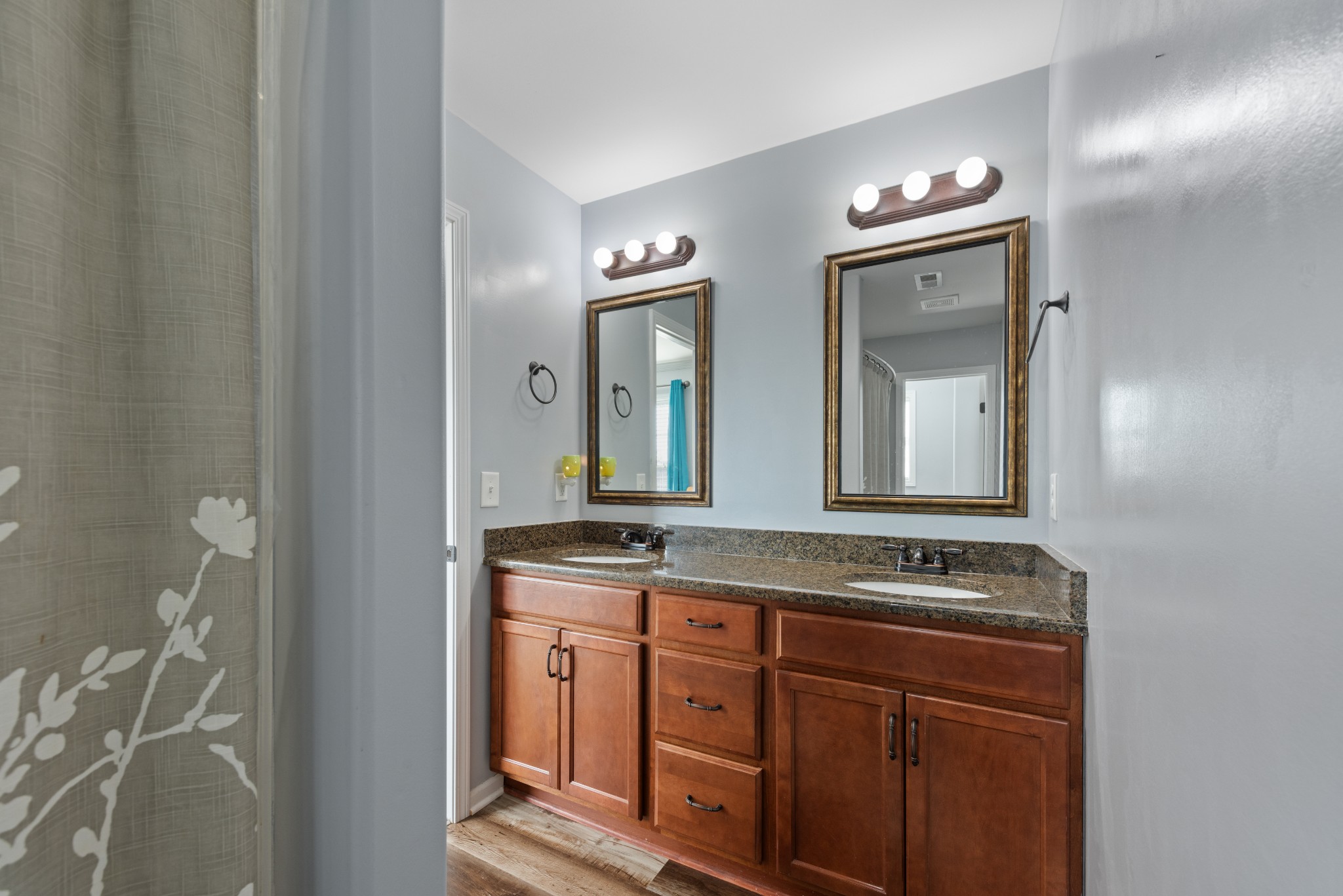 3758 Suiter Road Clarksville, TN 37040 - Photo 17 of 33 a bathroom with a granite countertop sink a mirror and a