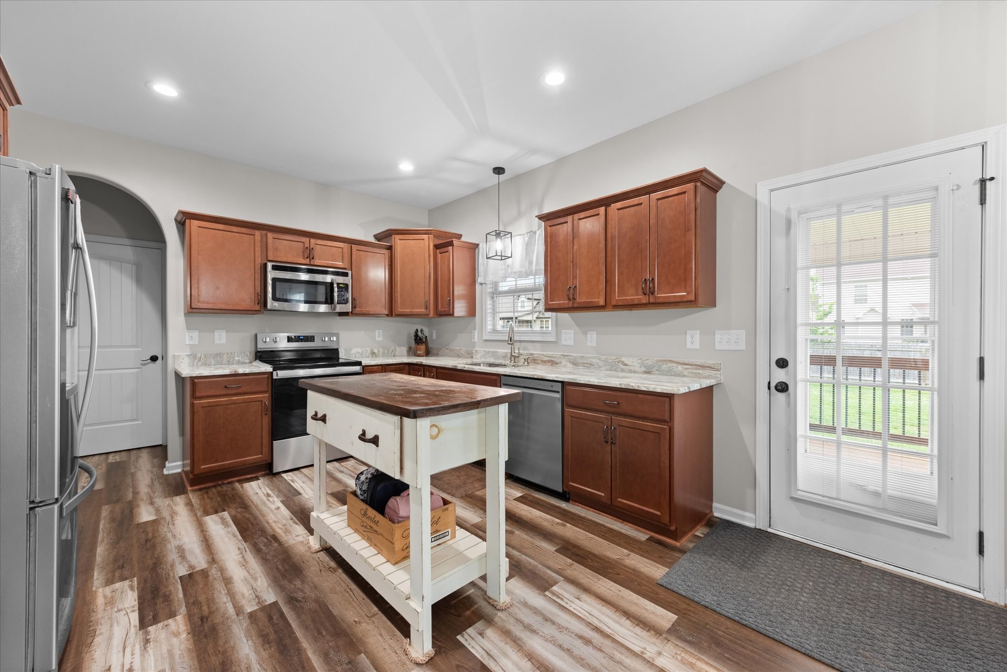 3758 Suiter Road Clarksville, TN 37040 - Photo 9 of 33 a kitchen with stainless steel appliances granite countertop a stove sink and cabinets