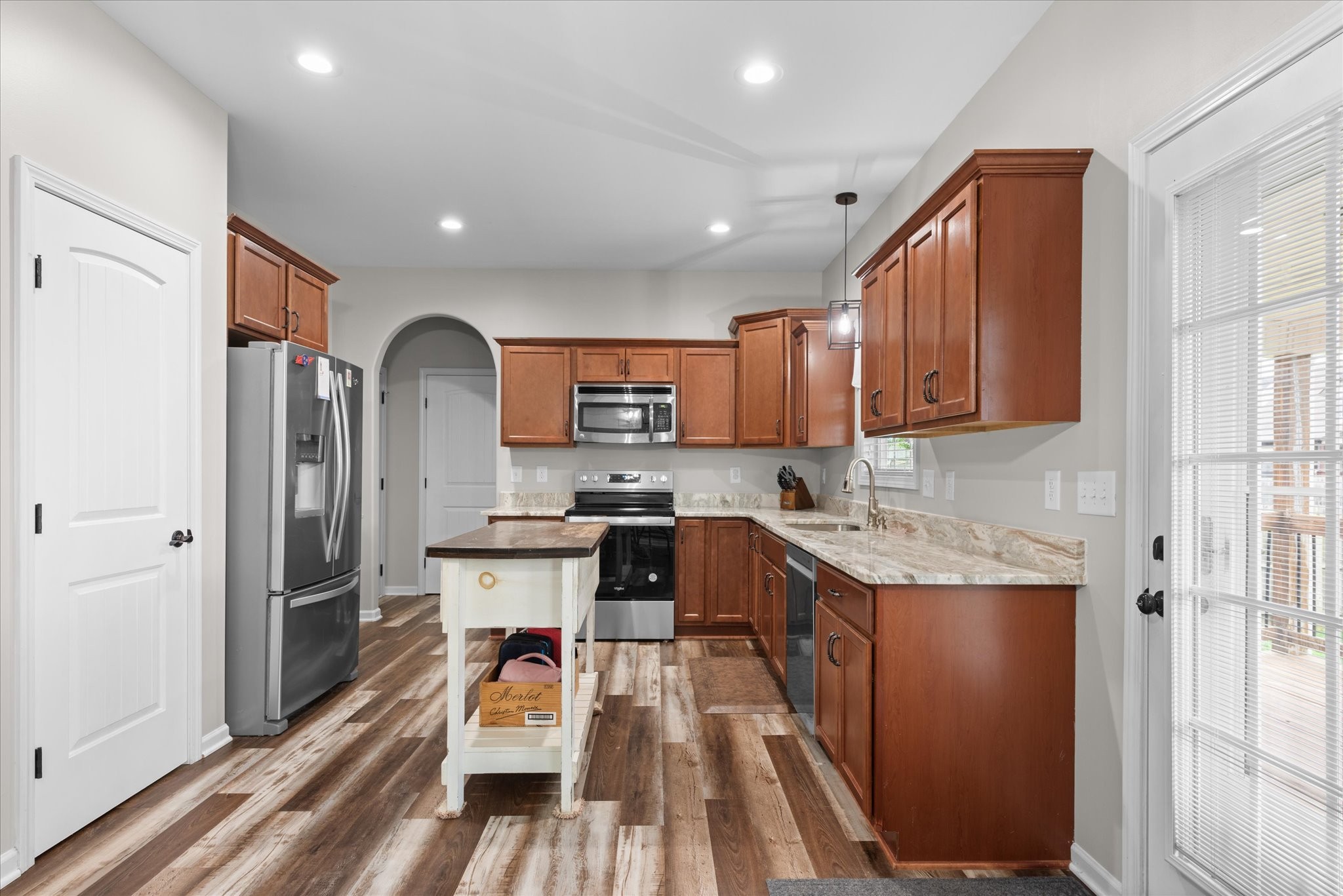 3758 Suiter Road Clarksville, TN 37040 - Photo 10 of 33 a kitchen with stainless steel appliances granite countertop sink refrigerator and microwave
