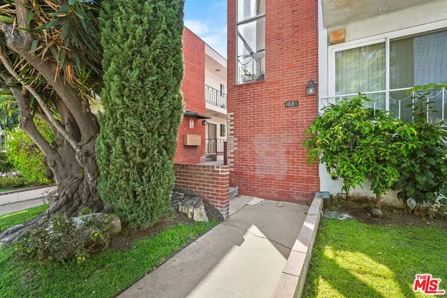 a brick building with a yard