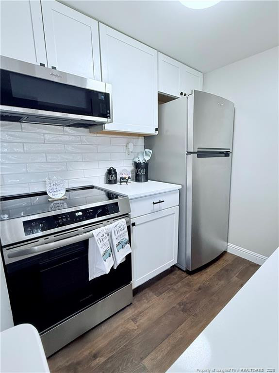 5 Pine Tree Road Pinehurst, NC 28374 - Photo 12 of 45 a kitchen with a stove microwave and refrigerator