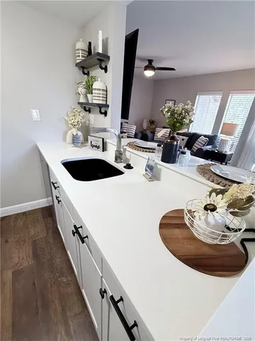 a kitchen with sink and stove
