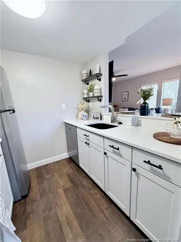 a spacious bathroom with double vanity sink a mirror and vanity