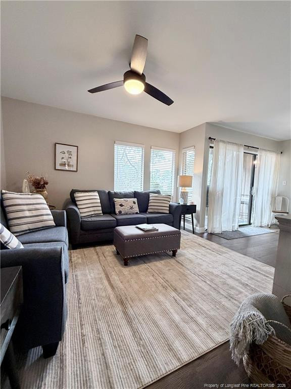 5 Pine Tree Road Pinehurst, NC 28374 - Photo 24 of 45 a living room with furniture and a chandelier