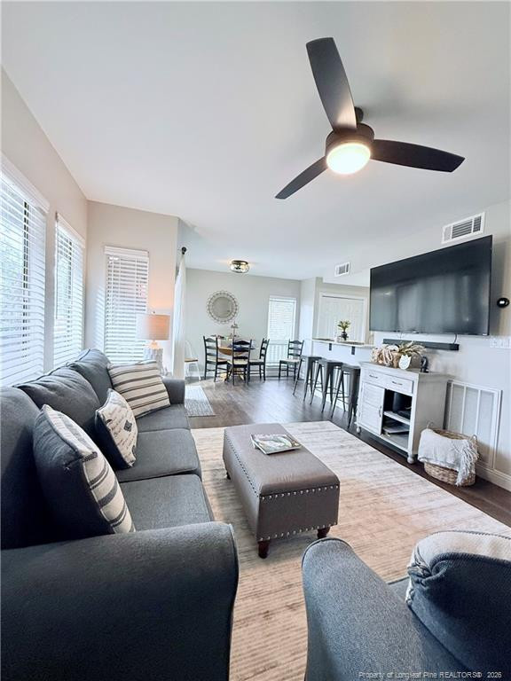 5 Pine Tree Road Pinehurst, NC 28374 - Photo 28 of 45 a living room with furniture and a flat screen tv