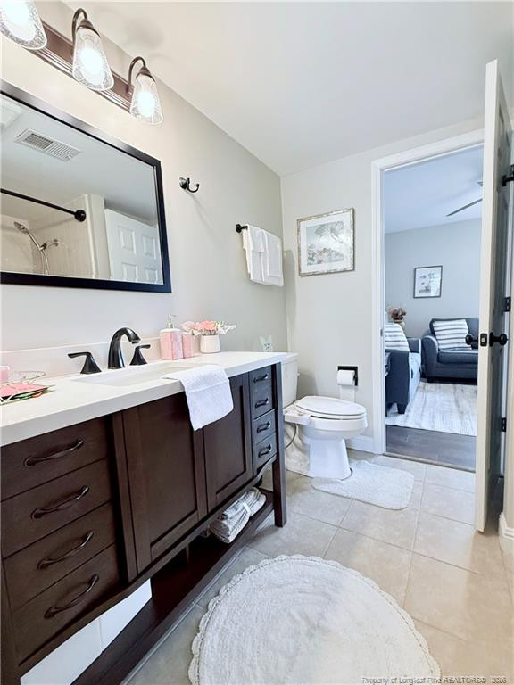 5 Pine Tree Road Pinehurst, NC 28374 - Photo 30 of 45 a bathroom with a double vanity sink mirror and toilet