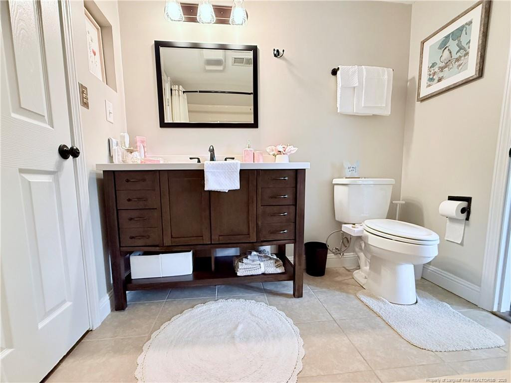 5 Pine Tree Road Pinehurst, NC 28374 - Photo 32 of 45 a bathroom with a sink toilet and mirror
