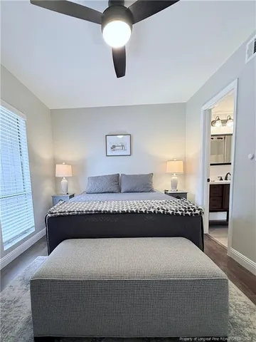 a bedroom with a bed and window