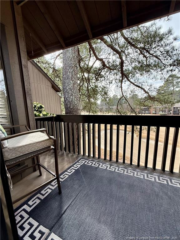 5 Pine Tree Road Pinehurst, NC 28374 - Photo 39 of 45 a view of backyard with wooden deck and outdoor seating