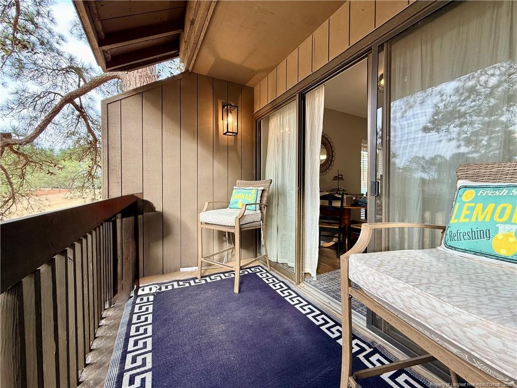 5 Pine Tree Road Pinehurst, NC 28374 - Photo 40 of 45 a view of a balcony with chair and table
