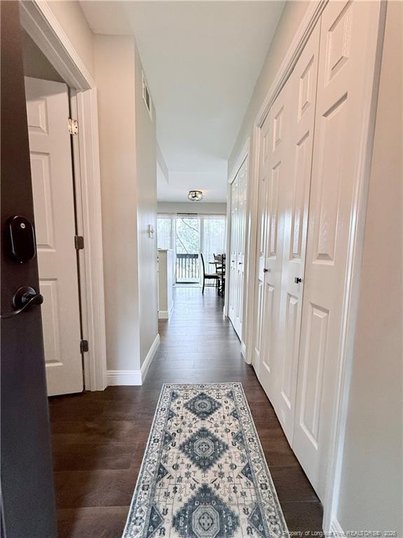 5 Pine Tree Road Pinehurst, NC 28374 - Photo 5 of 45 a view of a hallway with wooden floor and staircase
