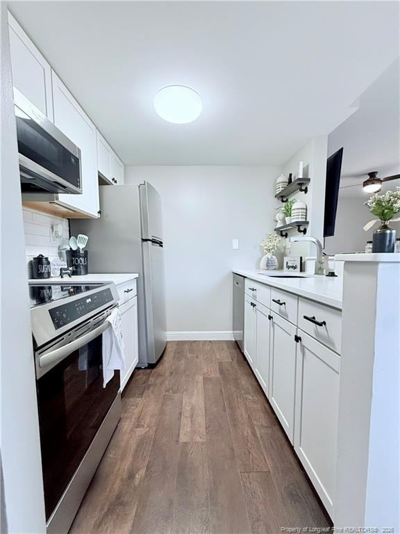 5 Pine Tree Road Pinehurst, NC 28374 - Photo 6 of 45 a kitchen with stainless steel appliances a sink stove and refrigerator