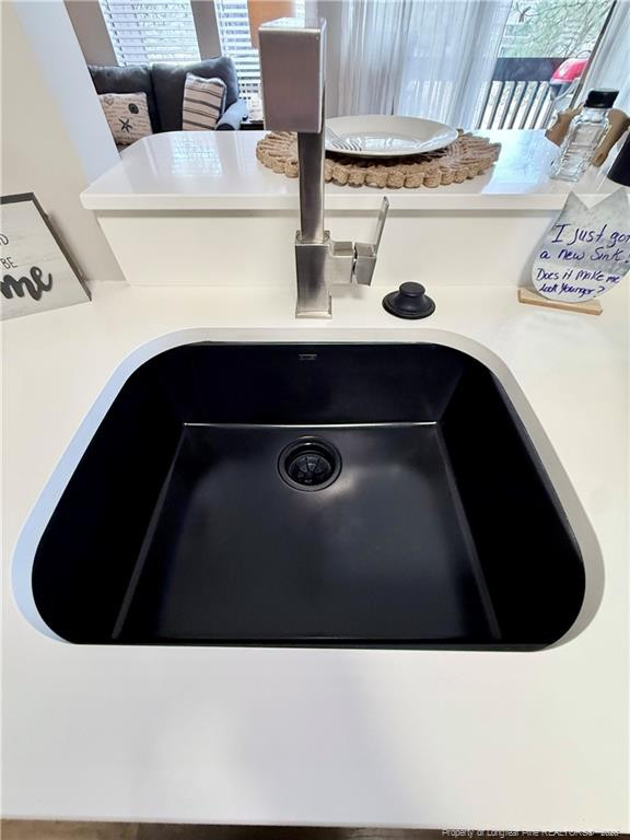 5 Pine Tree Road Pinehurst, NC 28374 - Photo 8 of 45 a kitchen with a sink and cabinets