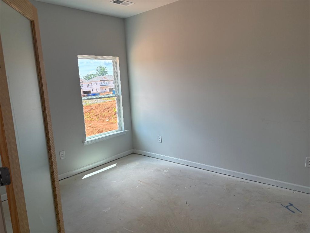 129 Cedar Shoals Easley, SC 29640 - Photo 8 of 31 A well-lit, unfurnished room offers potential for personalization.