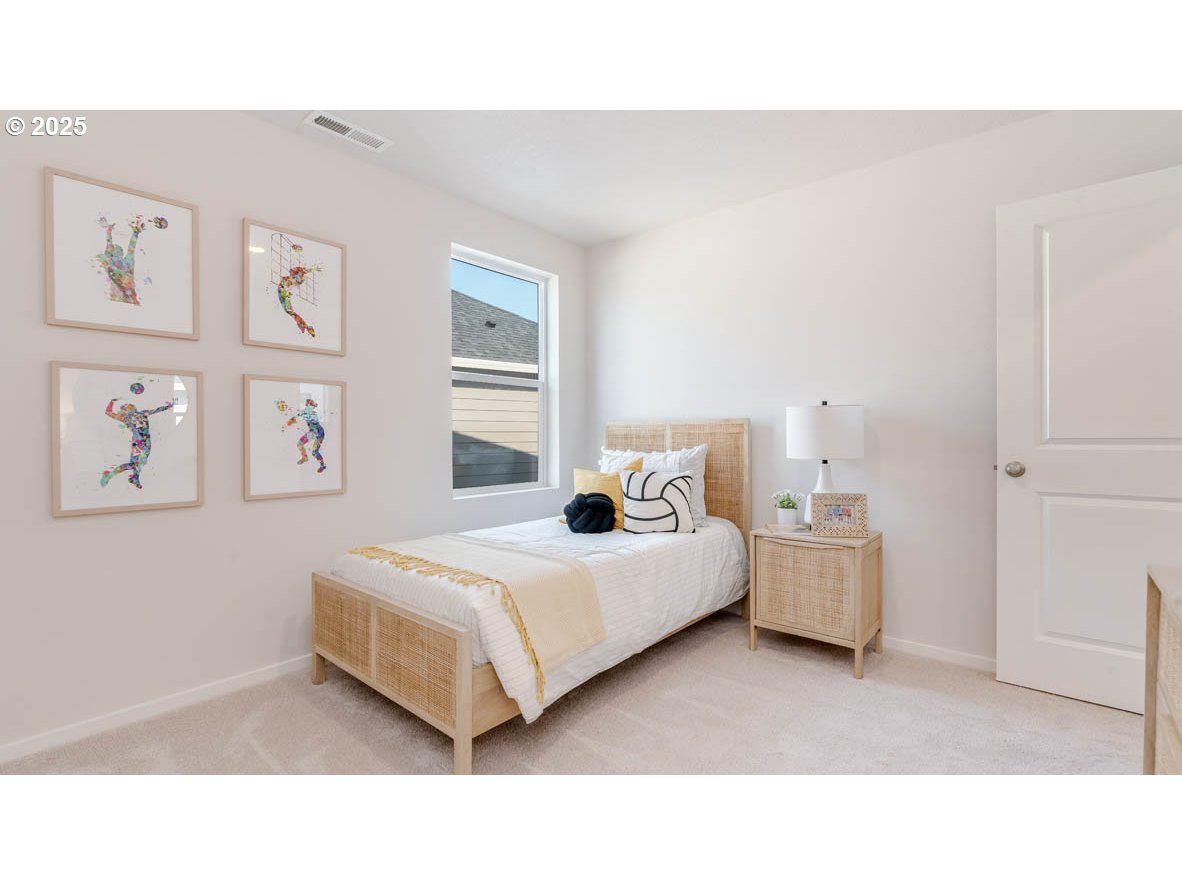 2805 U Street Springfield, OR 97477 - Photo 22 of 31 a living room with a bed and wall painting