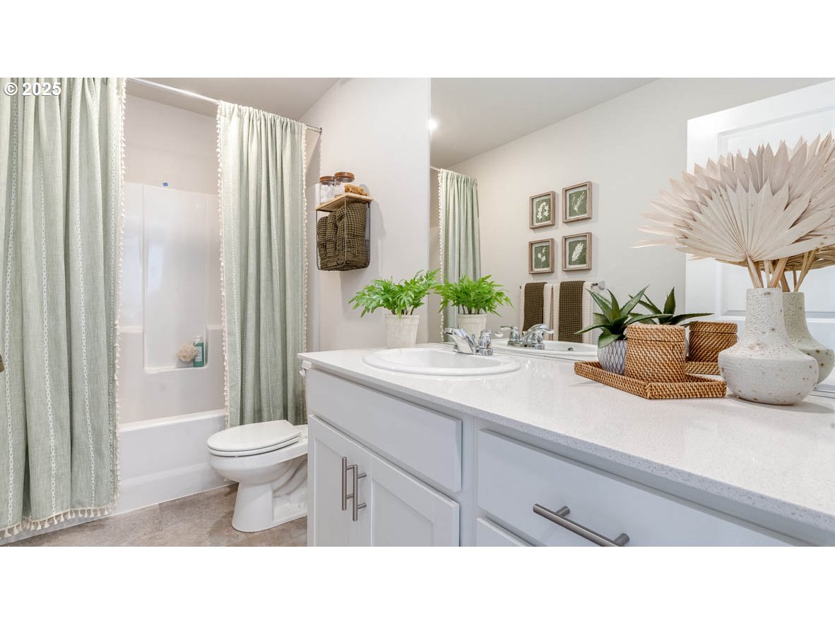 2805 U Street Springfield, OR 97477 - Photo 23 of 31 a bathroom with a sink a toilet and shower