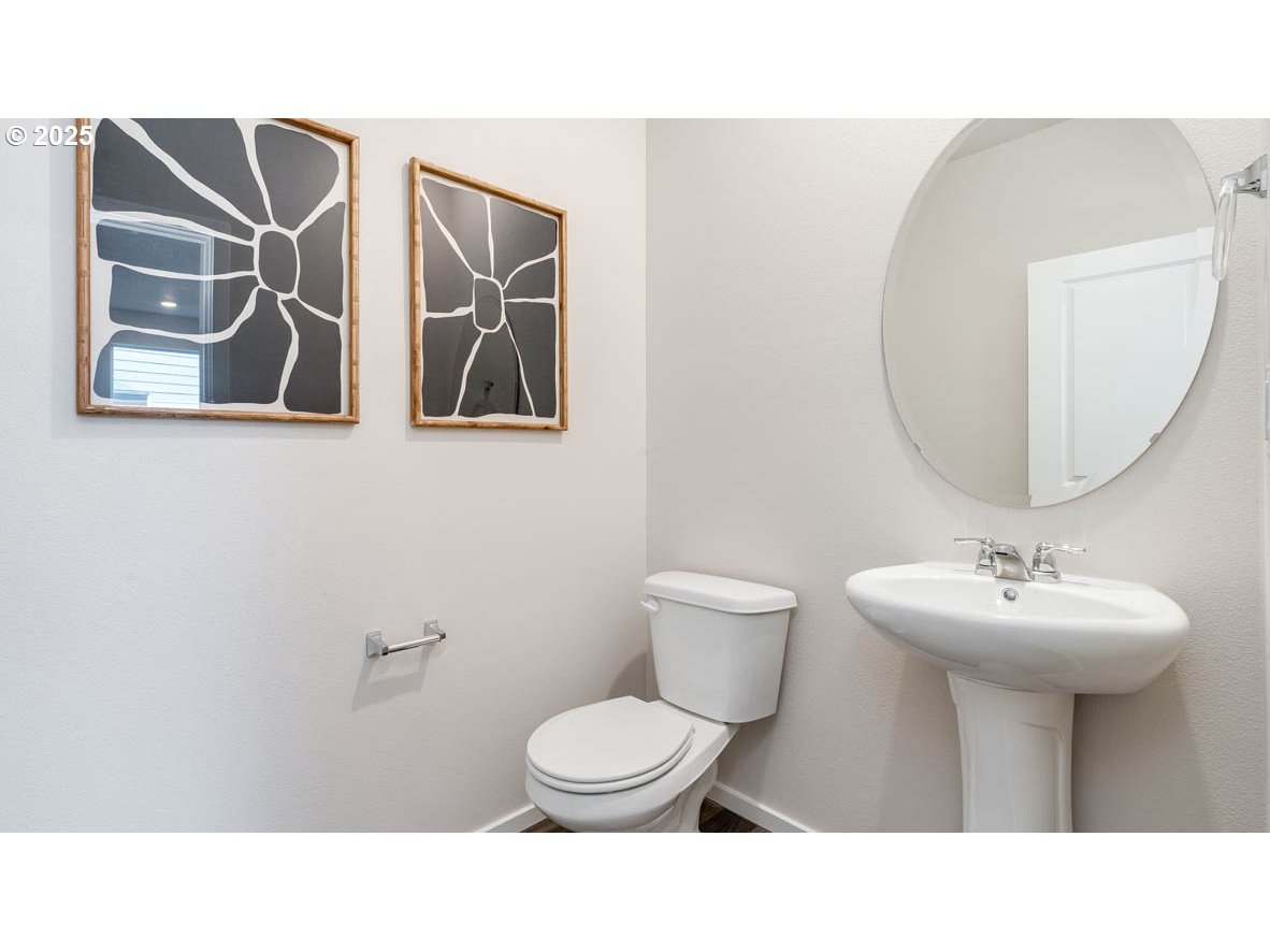 2805 U Street Springfield, OR 97477 - Photo 30 of 31 a bathroom with a sink toilet and mirror