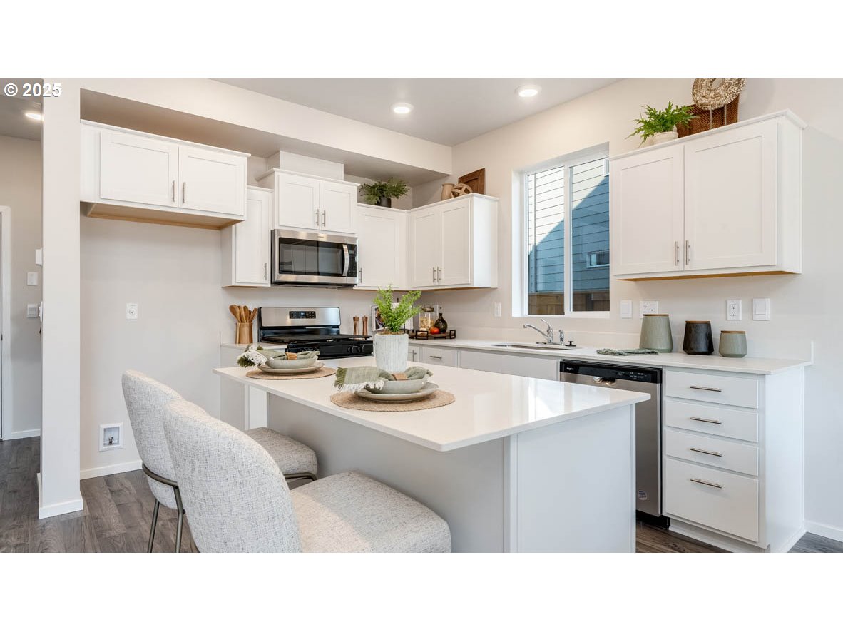 2805 U Street Springfield, OR 97477 - Photo 6 of 31 a kitchen with appliances a sink and a cabinets